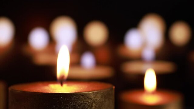 Funeral candles on a black background.