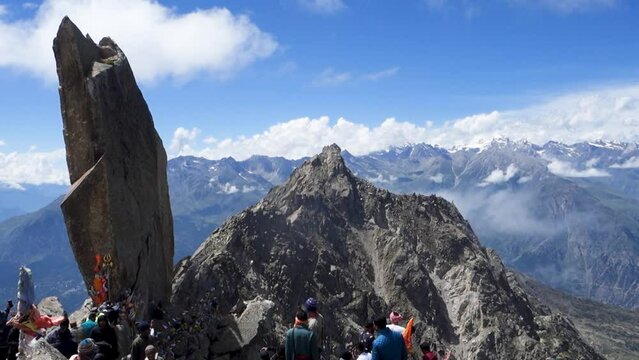 Devotees praying at Rock Shivling, part of the Hindu pilgrimage Kinner Kailash Yatra in Himachal Pradesh