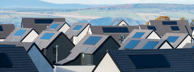 Houses with solar panels build into the roofs in Sctoland, UK