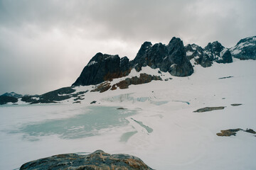Ojo del Albino glacier and lake located in the hiking trail in Tierra Mayor valley, Tierra del...