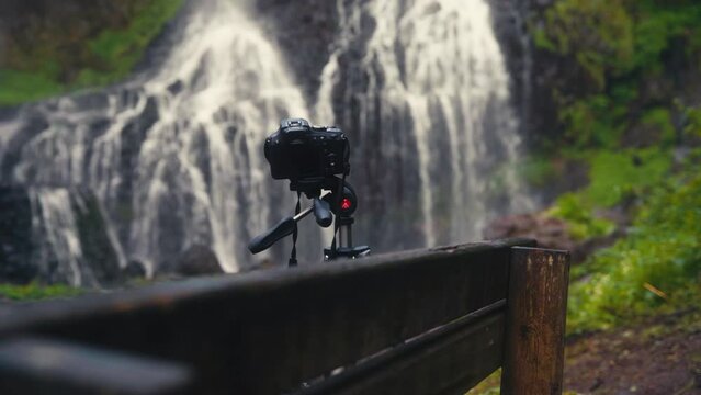 Camera filming a waterfall