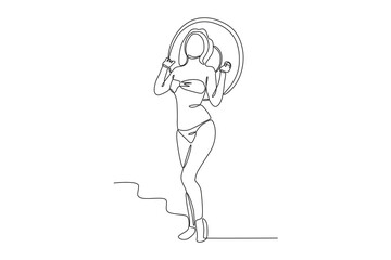 A woman carrying a swimming balloon