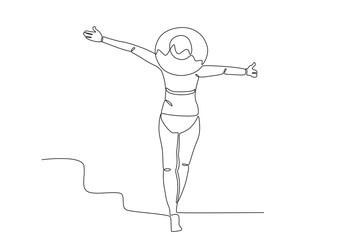 A woman is posing in a swimsuit and hat