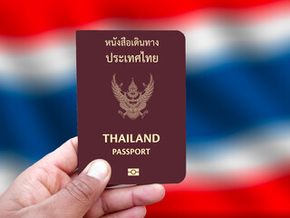 Thailand passport holding in hand