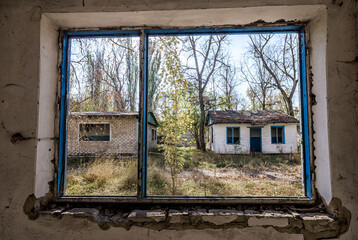 view from the window of an abandoned abandoned house in the village of Ukraine