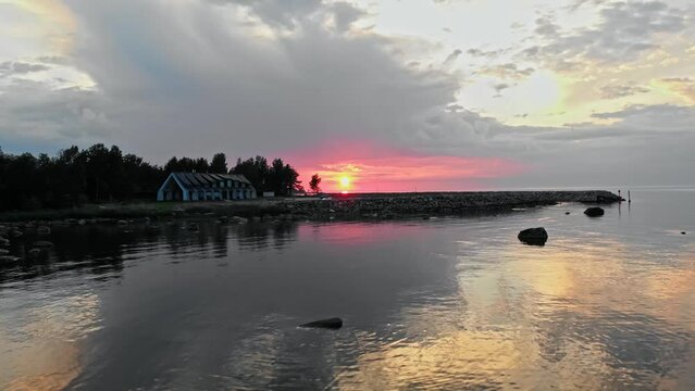 sunset over the sea with rocks