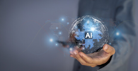 Artificial intelligence AI shaped as an electronic circuit symbol. on the hand of a businessman...