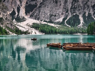Lago di Braies and wooden boats, Dolomites, Italy	