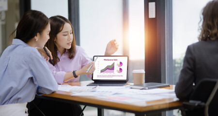 Technology and financial advisory services concept. Business teamwork and working on digital laptop computer with advisor showing plan of investment to clients at table office. Digital marketing.