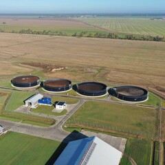 Tanks, huge round cisterns, storage tanks for liquid manure at a dairy farm. Environmentally friendly processing of manure into fertilizer. Livestock manure processing plant. Liquid manure.