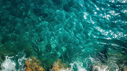 An ethereal sea of teal and turquoise hues dances with fluid grace, revealing a vibrant underwater world teeming with life and beauty