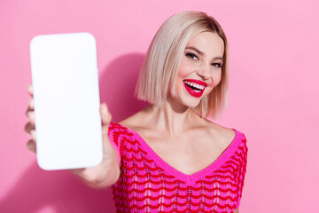 Photo of adorable cute woman with bob hairstyle dressed knit top showing menu on smartphone display...