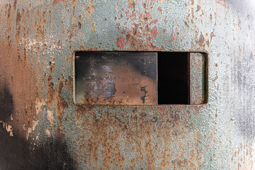 window on military heavy armor, metallic rusted texture
