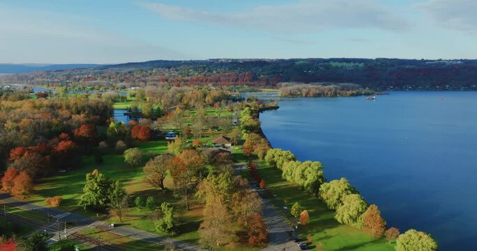 Fall, autumn, drone aerial videos with view of Stewart Park at the south end of Cayuga Lake, Ithaca New York.  11-03-2024