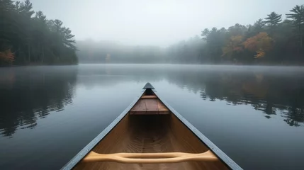 Zelfklevend Fotobehang Bow of a canoe in the morning on a misty lake in Ontario, Canada.    © Emil