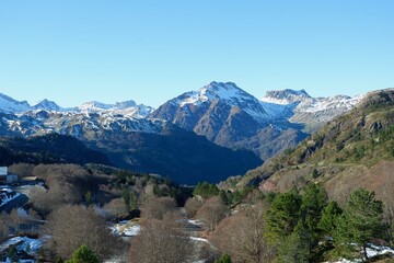 Calm mountain landscape with snow melting on the peaks at the border between Spain and France....