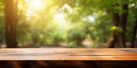 Fototapeta premium Blurred nature background with a wooden desk.