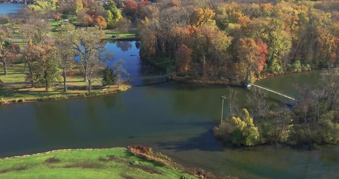 Fall, autumn, drone aerial videos with view of Stewart Park at the south end of Cayuga Lake, Ithaca New York.  11-03-2024