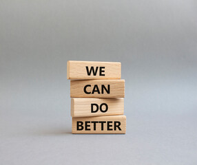 We Can Do Better symbol. Concept words We Can Do Better on wooden blocks. Beautiful grey background. Business and We Can Do Better concept. Copy space.