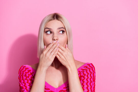 Photo of worried person hands covering mouth look interested empty space isolated on pink color background
