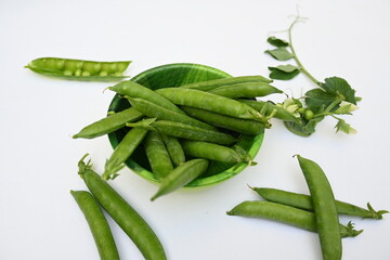 Fresh green pea isolated on white background. There is a lot of vitamins  and Minerals in it. The pea is most commonly the small spherical seed or the seed. Popular vegetable of all over world. 
