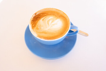 cup of coffee on the table whit paint one heart