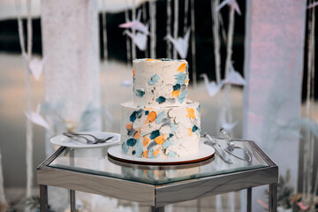 Large luxury wedding cake on a background of arch.  Wedding decor.