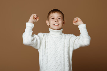 Portrait of enthusiastic teen boy winning and celebrating victory, achieve goal, scream wow in...