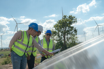 engineer man inspects construction of solar cell panel or photovoltaic cell by electronic device....