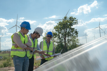 engineer man inspects construction of solar cell panel or photovoltaic cell by electronic device....