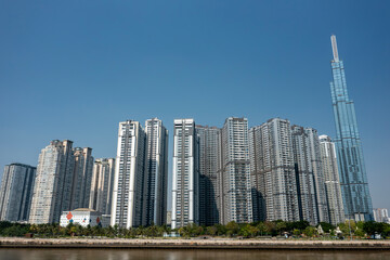 Obraz premium Landmark, Building, Central Park, Saigon River and Ho Chi Minh City Riverfront Vietnam on a sunny day with blue sky 