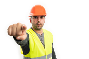 Builder making serious expression pointing finger with copyspace