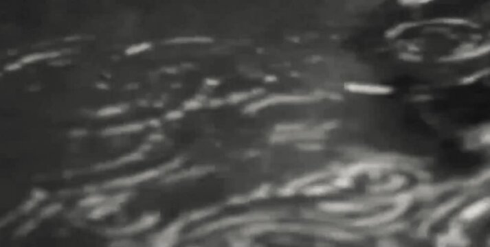splashing water that occurs when rainwater falls on a puddle