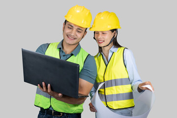 Asian Couple Engineer & Architect gives gestures and expressions on construction field with laptop