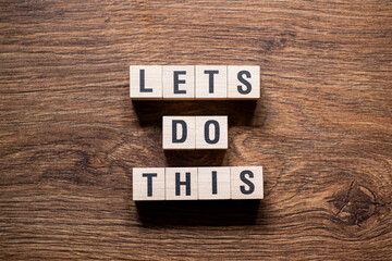 Lets do this - word concept on building blocks, text