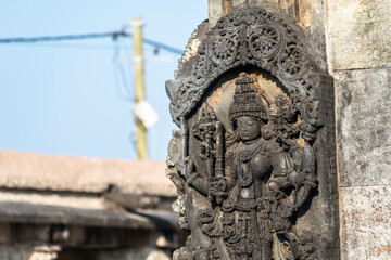 Ornate carving of a Hindu deity on the walls of the ancient Chennakeshava temple.