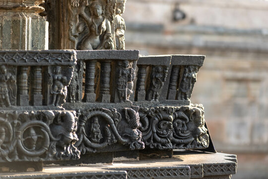 Ornamental detail of intricate carvings on the walls of the ancient Chennakeshava temple in Belur, Karnataka.