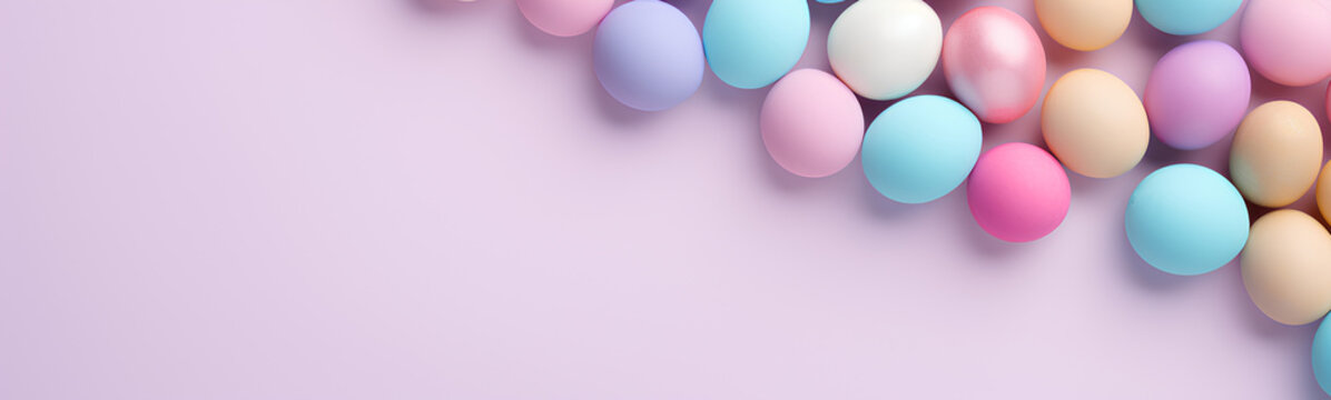 Flat lay of colored Easter eggs. Plain pastel background.