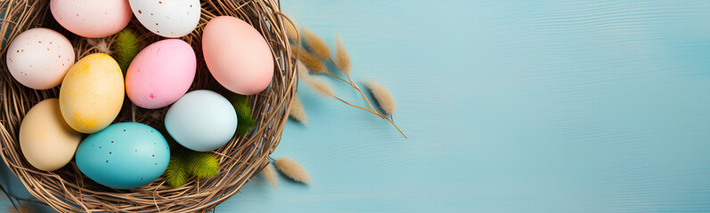 Colorful Easter eggs in a straw basket. Pastel colored background.
