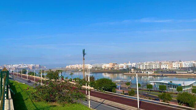 4K video of Modern tram passing by the Bou Regreg river and Scenic view of old city of oudaya with a view over the Grand Theatre of the capital city of Morocco, RABAT