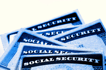 Social Security Cards in a Row Pile for Retirement blue color