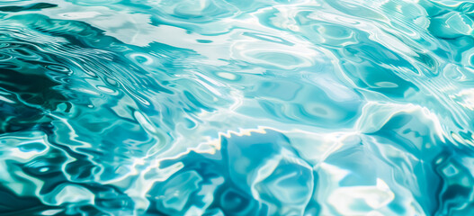 Obraz premium A close-up view of water surface with intricate rippling patterns. The ripples create abstract shapes. The shades of turquoise and white are visible, creating a mesmerizing effect.
