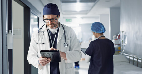 Surgeon, doctor and tablet for hospital, healthcare or clinic research, online planning and schedule management. Medical professional typing on digital technology for surgery results, charts or data - Powered by Adobe