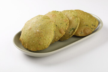 Indian cuisine - Puri Bhaji. It is a traditional breakfast dish in North India. Puri is a deep fried bread made from whole wheat flour and Served with spicy Potato curry called bhaji or alu ki sabji.