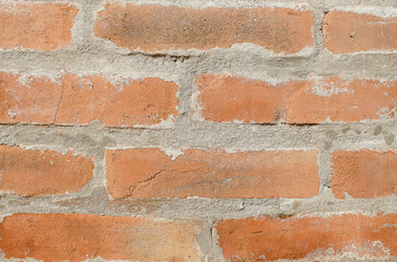 Texture of red bricks made of clay and fixed with concrete.
