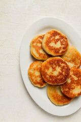 Chvishtari, corn flour tortillas with cheese, pastries, Georgian cuisine, Mchadi, homemade, top view, on a wooden table, no people,