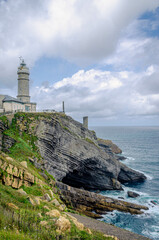 Fototapeta na wymiar The Cabo Mayor Lighthouse presides over the entrance to the Bay and is a privileged balcony to the Cantabrian Sea and the City of Santander.