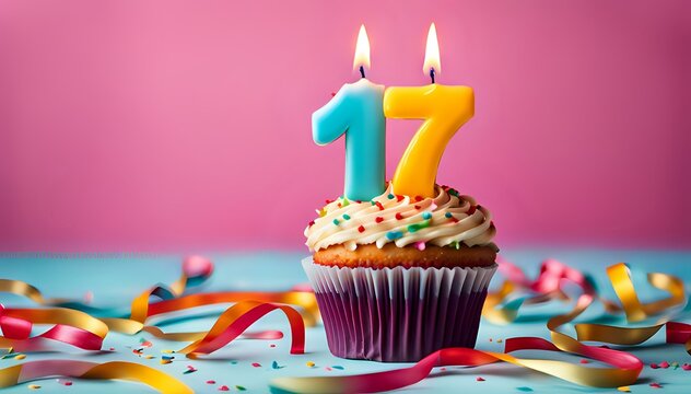 Birthday cupcake with burning lit candle with number 17. Number seventeen for seventeen years or seventeenth anniversary.