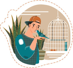 Young man with a backwards cap gently holding a small bird on his hand, indoor plants nearby. Friendly interaction between pet owner and his cute parakeet next to a birdcage.