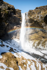 waterfall with rainbow in iceland